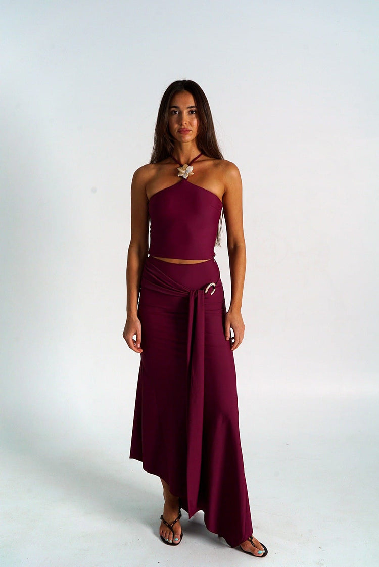 Waev Solstice Skirt in burgundy, full length front view showing asymmetric hem